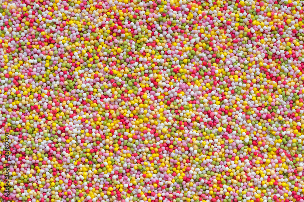Tiny ball-shaped rainbow sprinkles top view
