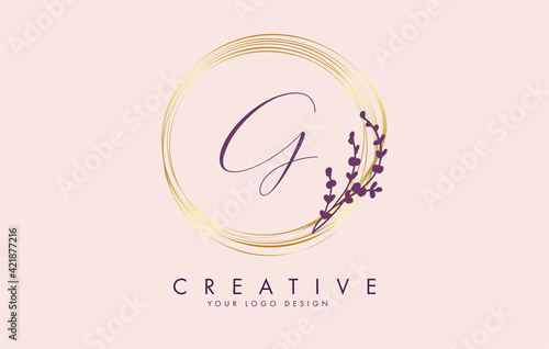 Handwritten G Letter logo design with golden circles and purple leaves on branches around. Vector Illustration with G letter.
