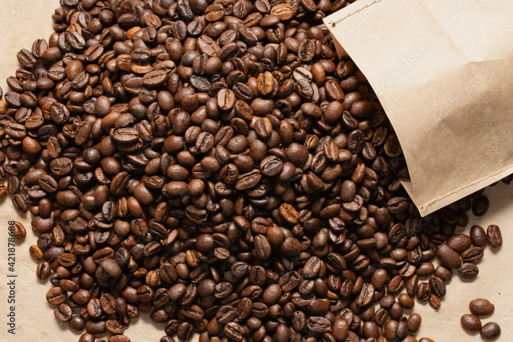 Fototapeta premium Coffee beans. Coffee beans are spread out on the surface.