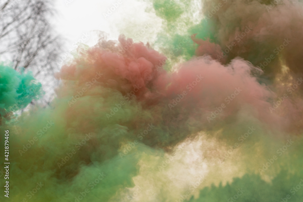 Pastel color smoke in the air from smoke flares (smoke bombs)