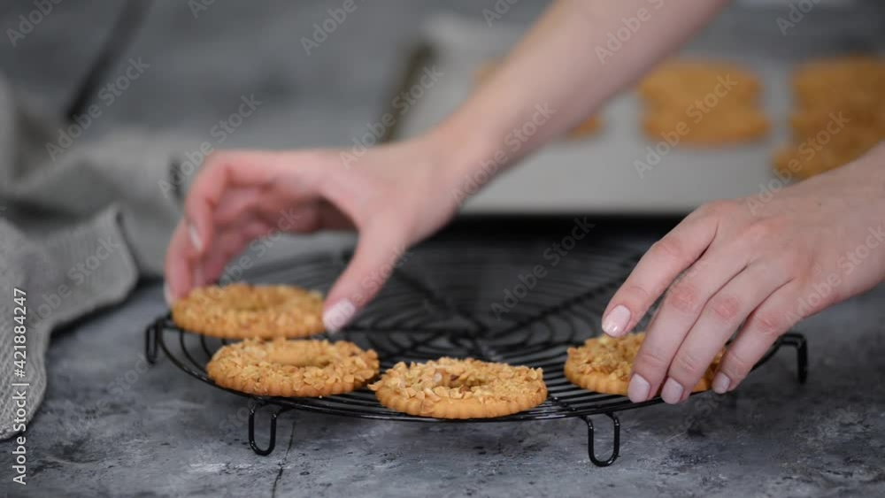 Shortbread cookie ring with peanuts on cooling rack. Shortbread cookie ring with peanuts on cooling rack.