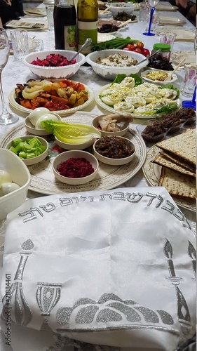 Festive Passover table setting with Torah, top view. Pesach celebration