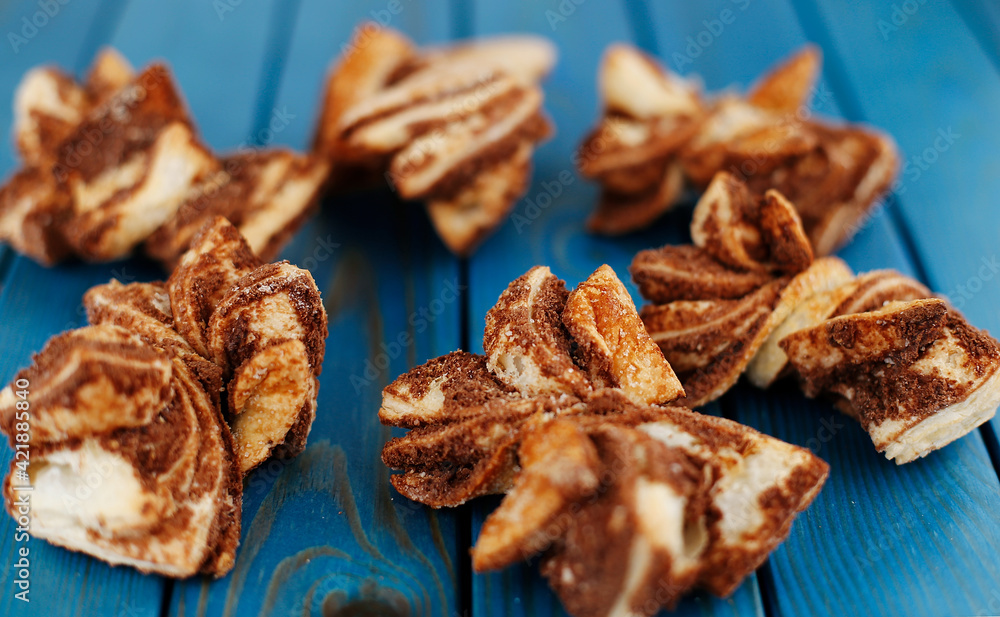 Cinnamon cookies on a blue wooden background. Homemade cakes. Cinnamon cookies on a blue wooden background. Homemade cakes.