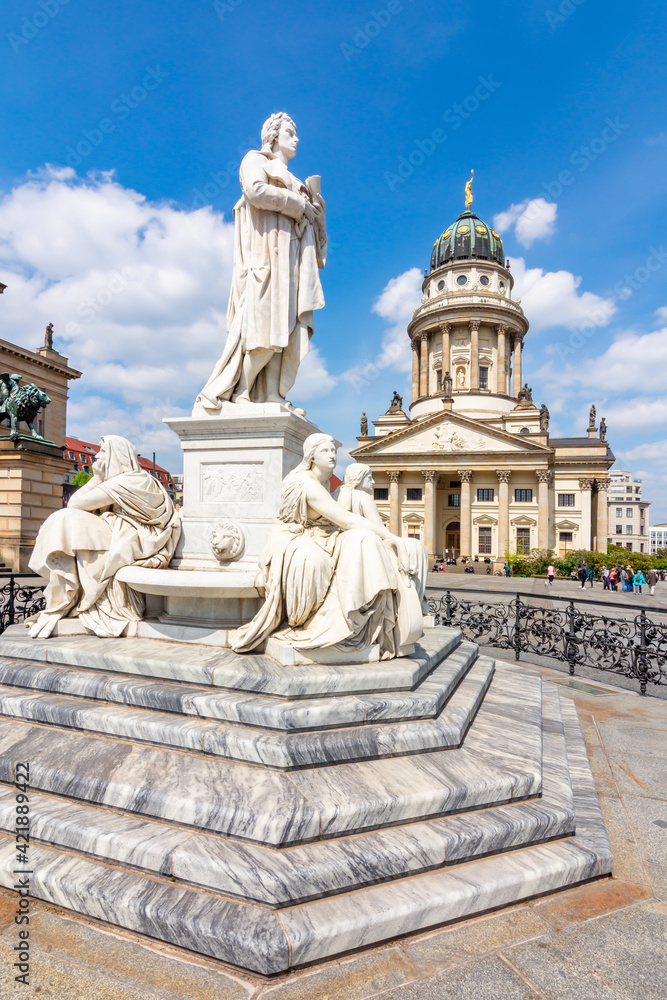 Schiller monument and French Church dome on Gendarmenmarkt square, Berlin, Germany
