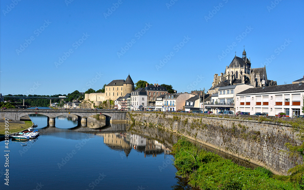 River in the town of Mayenne with Notre-Dame basilica and the castle, commune in the Mayenne department in north-western France