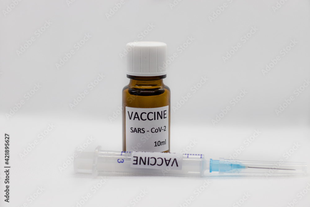 Close-up medical syringe with a vaccine. Vaccine ampoule full of anti-virus medicine, ready for vaccination. A coronavirus pandemic. Vaccination phase. Coverage protection 19. Close-up medical syringe with a vaccine. Vaccine ampoule full of anti-virus medicine, ready for vaccination. A coronavirus pandemic. Vaccination phase. Coverage protection 19.