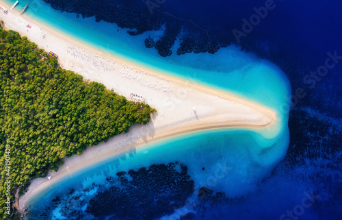 Croatia, Hvar island, Bol town. Landscape from air. Aerial view at Zlatni Rat beach. Famous place in Croatia. Summer seascape from drone. Travel and vacation image