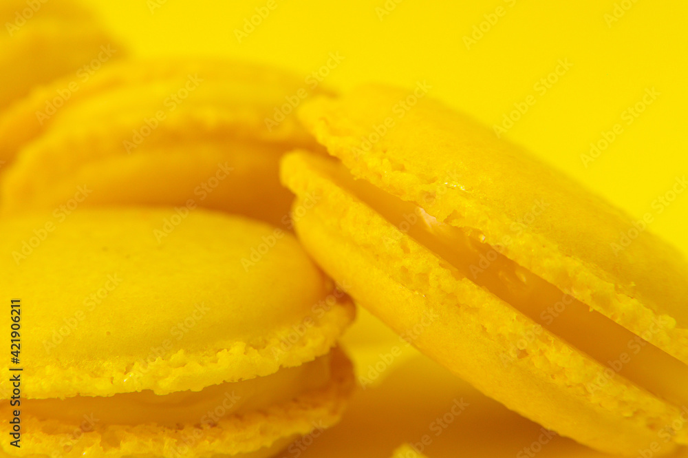 Yellow macaroons on yellow background Yellow macaroons on yellow background