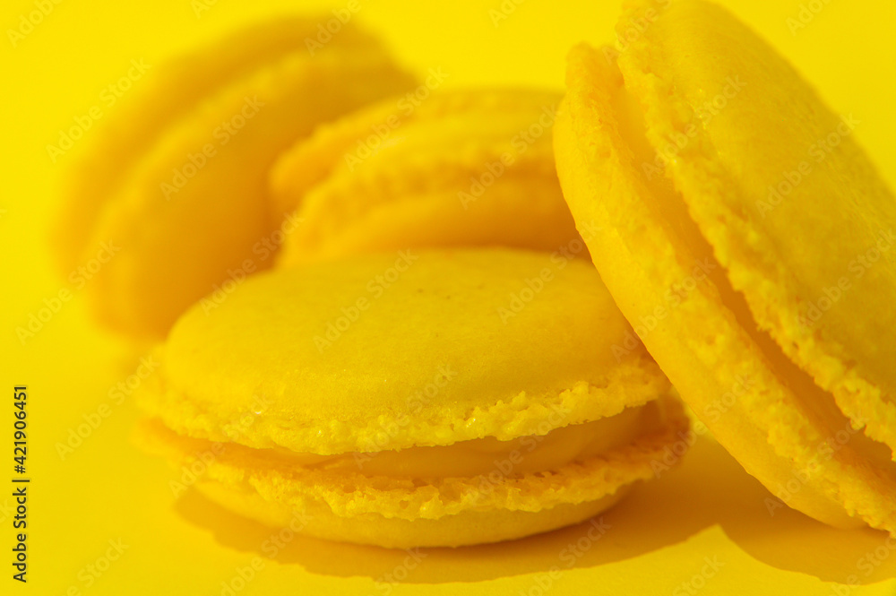 Yellow macaroons on yellow background Yellow macaroons on yellow background
