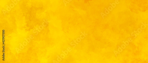 yellow orange abstract warm sunny bright saturated background with spots of watercolor paints. Universal yellow backdrop for decor