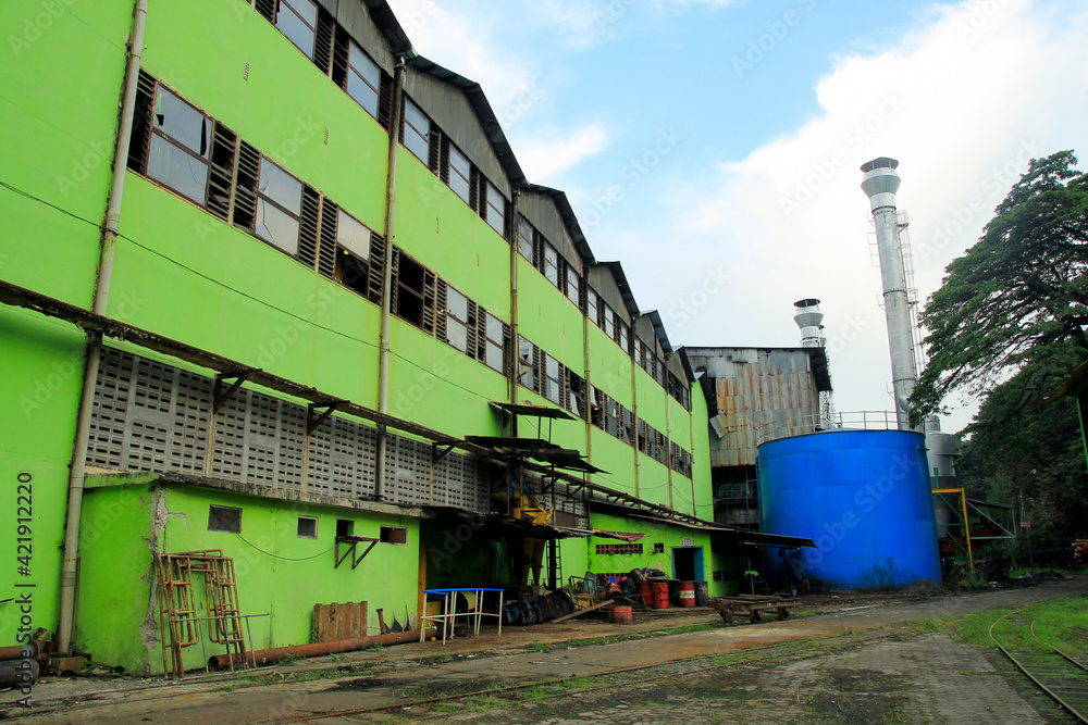 Obraz premium Yogyakarta, Indonesia, 05/01/2015. PT Madubaru Madukismo's sugar factory was built in 1955. The scrap metal from the factory was transported to Thailand and used to build the legendary Kwai Bridge.