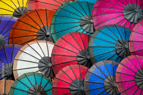 Colourful sun umbrellas at traditional street market in Luang Prabang, Laos. 