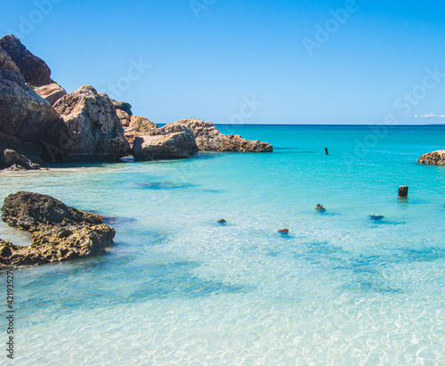 A beautiful turquoise cove on the Isla de Cajo de Muertos in the Caribbean Sea 10 miles off the coast of Ponce, Puerto Rico, USA.  Copy space. photo