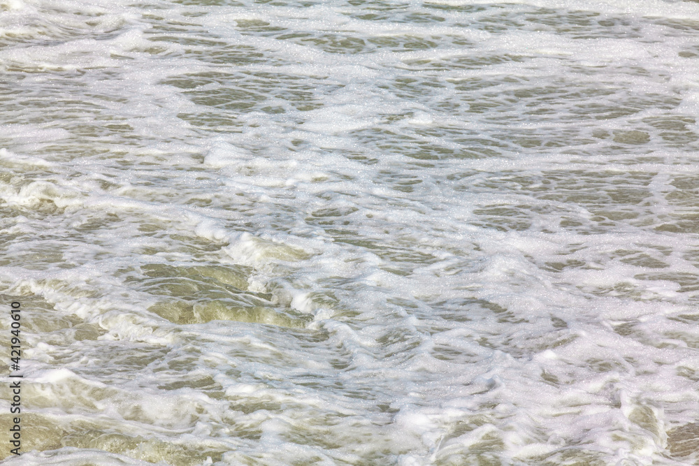 Surface of flowing water with foam . Dangerous place for swimming Surface of flowing water with foam . Dangerous place for swimming