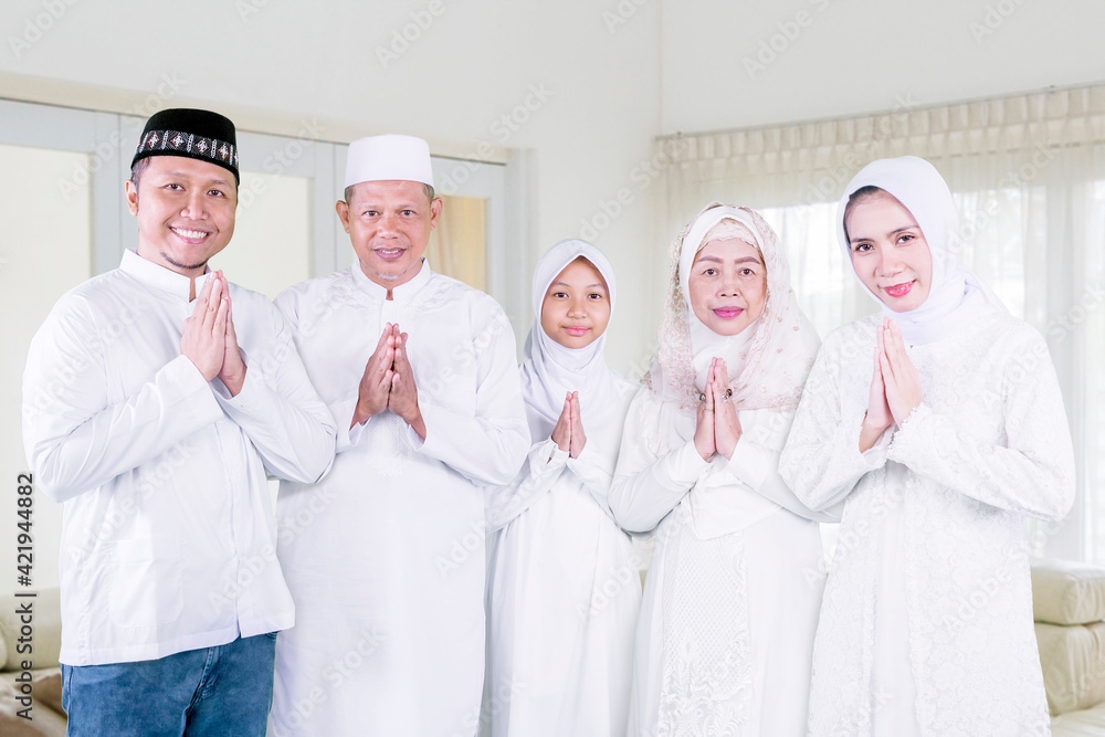 Muslim family show congratulate hands at home