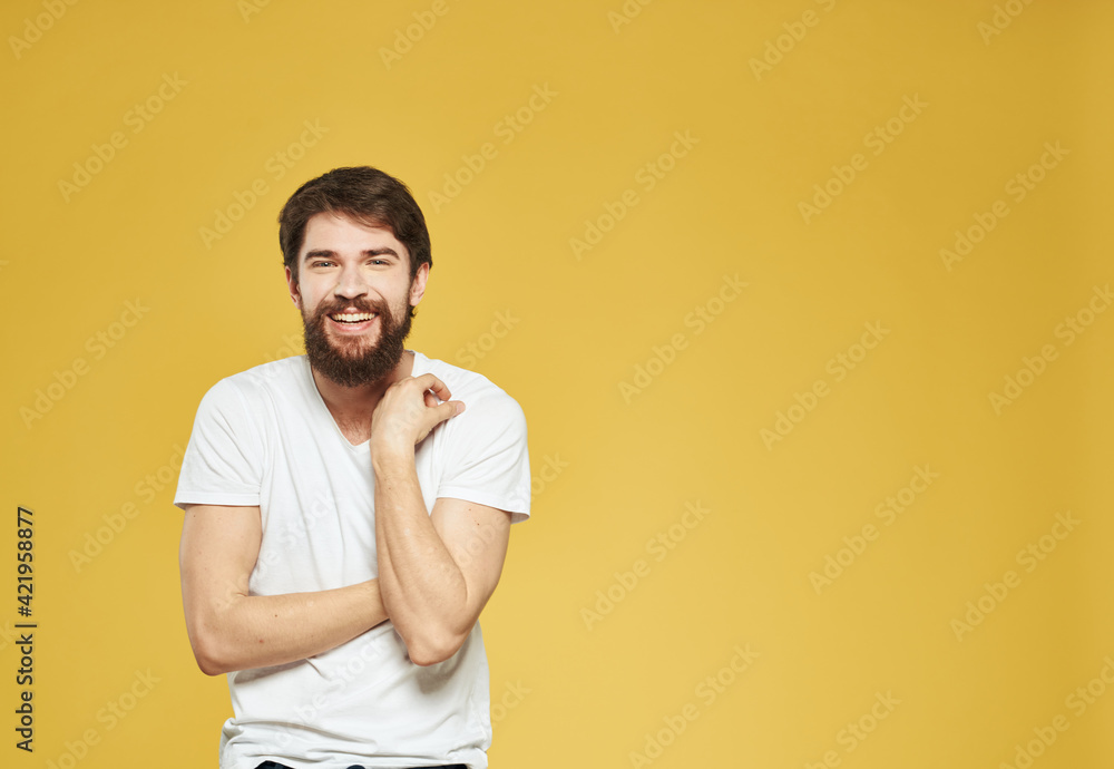 male model gesturing with his hands on a yellow background cropped view Copy Spac male model gesturing with his hands on a yellow background cropped view Copy Spac