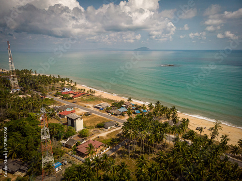 Aerial landscape photography of a fisherman village in the Terengganu coastal overlooking the mysterious depth of the South China Sea attracting nature lovers and tourists to seek the peace of mind.