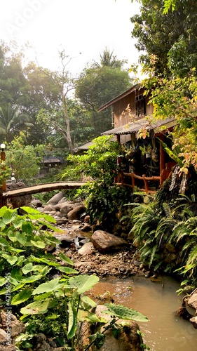 March 18 2021 - Ratchaburi, Thailand : Wooden house near  small creek in countryside, Thailand. © Veruree