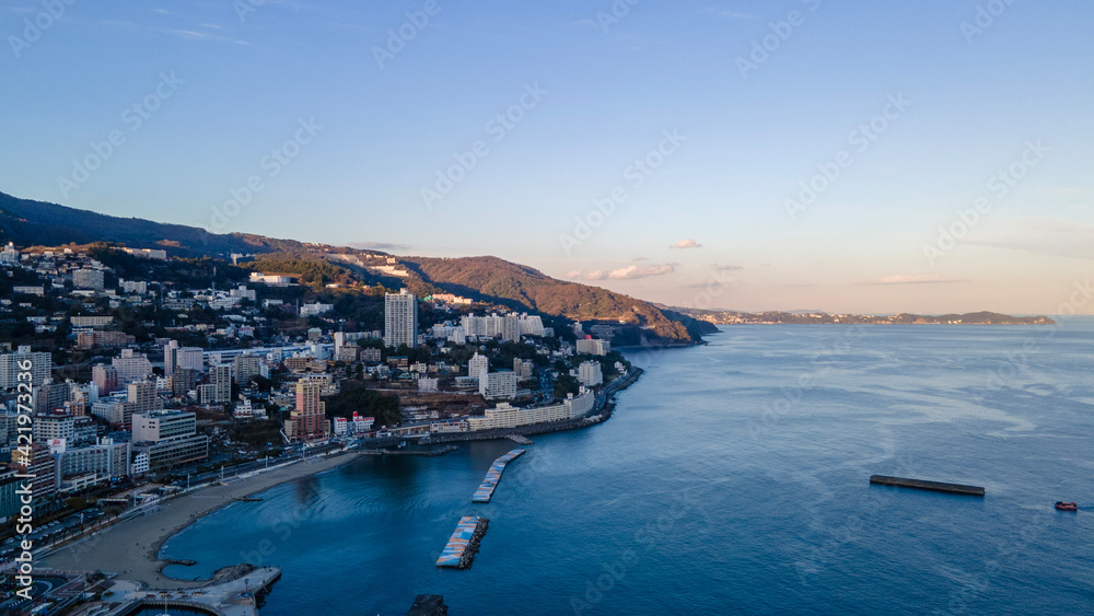 drone photo of Atami Japan shore during sunset