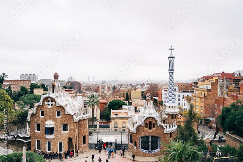 Barcelona, Spain - 15 December 2019: The central entrance to The Park Guell in Barcelona. Gingerbread houses.