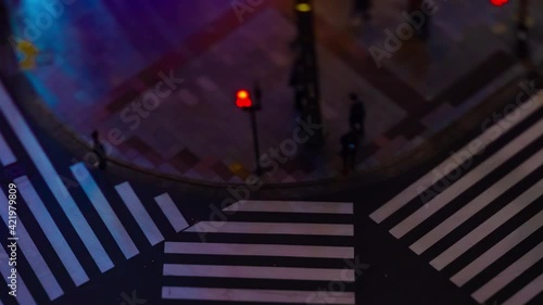 A night timelapse of the miniature traffic jam at the crossing in Ginza tiltshift zoom photo