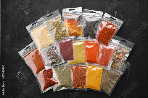 Fototapeta Naklejka Na Ścianę i Meble -  Different spices in plastic package