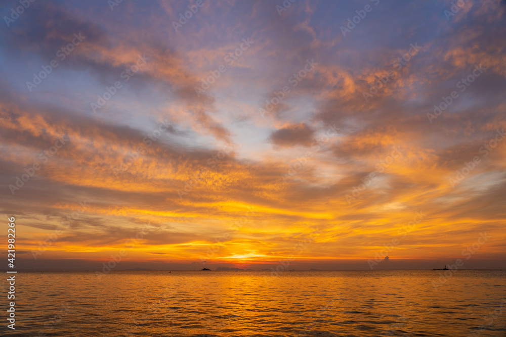 Beautiful sunset over the sea water on the island of Koh Phangan, Thailand