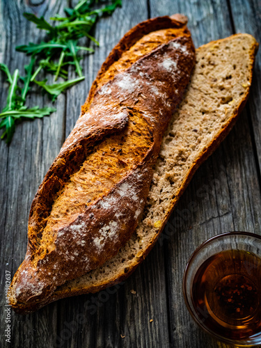 Fotografia Baguette on wooden table