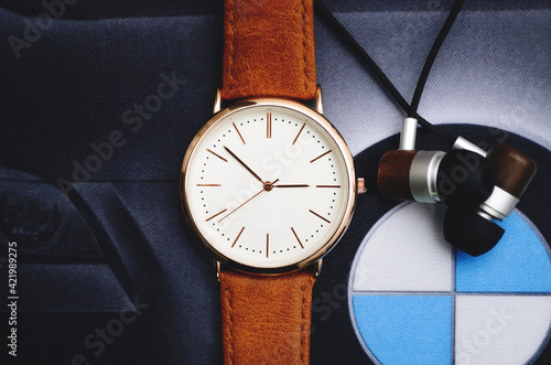 Wallpaper Mural Leather watch with headphones on a black background. Style for men Torontodigital.ca