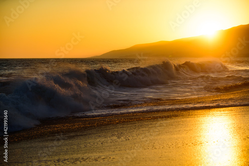 Ocean seascapes. Sea waves. Sunset on beach. Resort.