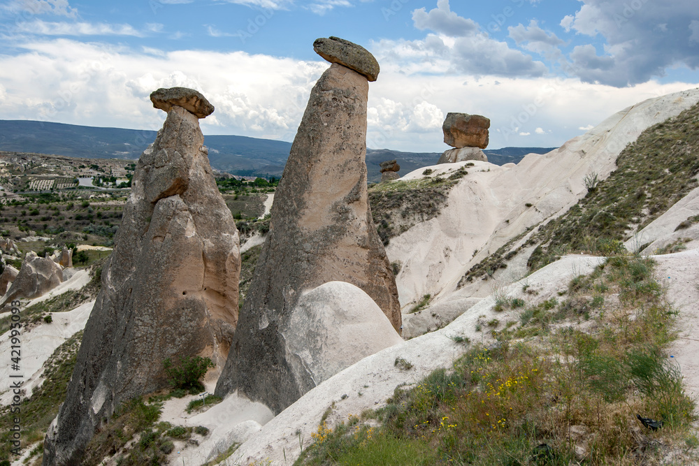 Fairy chimneys near Urgup in the Cappadocia region of Turkey. These unique rock formations were formed as a result of volcanic activity. Fairy chimneys near Urgup in the Cappadocia region of Turkey. These unique rock formations were formed as a result of volcanic activity.