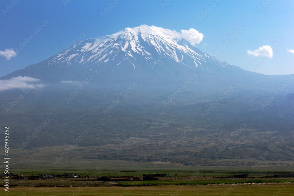A snow capped view of Mt Ararat on a hazy morning near the city of Dogubayazit in the far east border region of Turkey. 