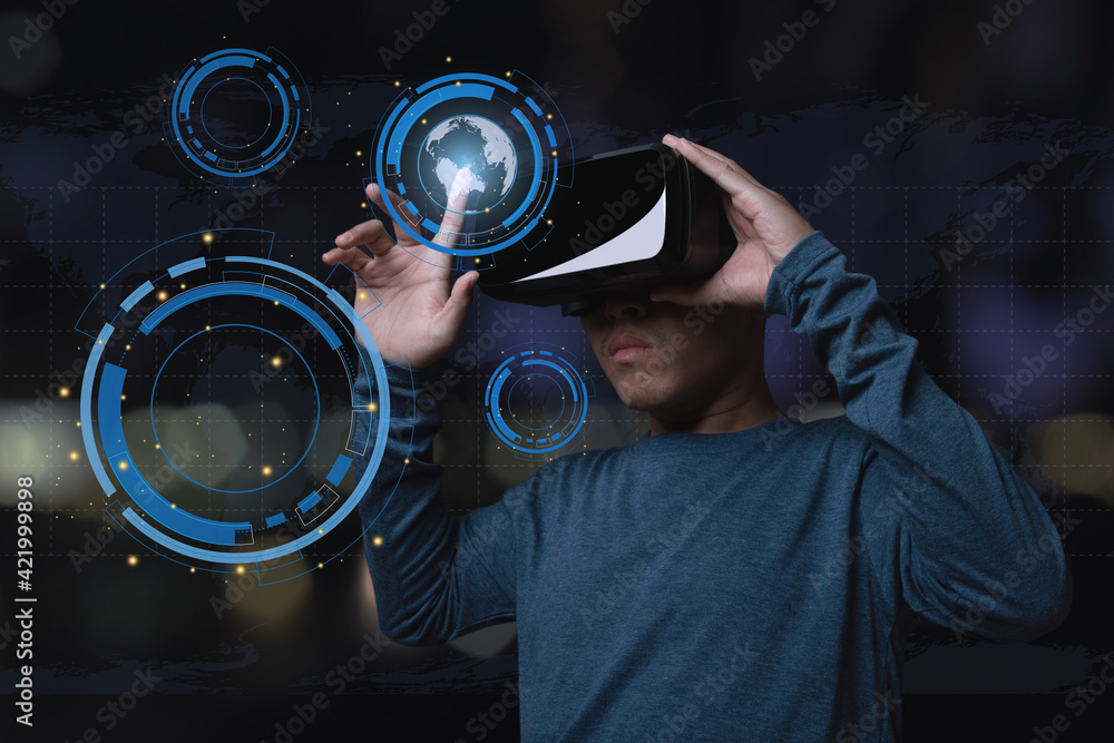 Young man using virtual reality headset with future technology innovation. Young man using virtual reality headset with future technology innovation.