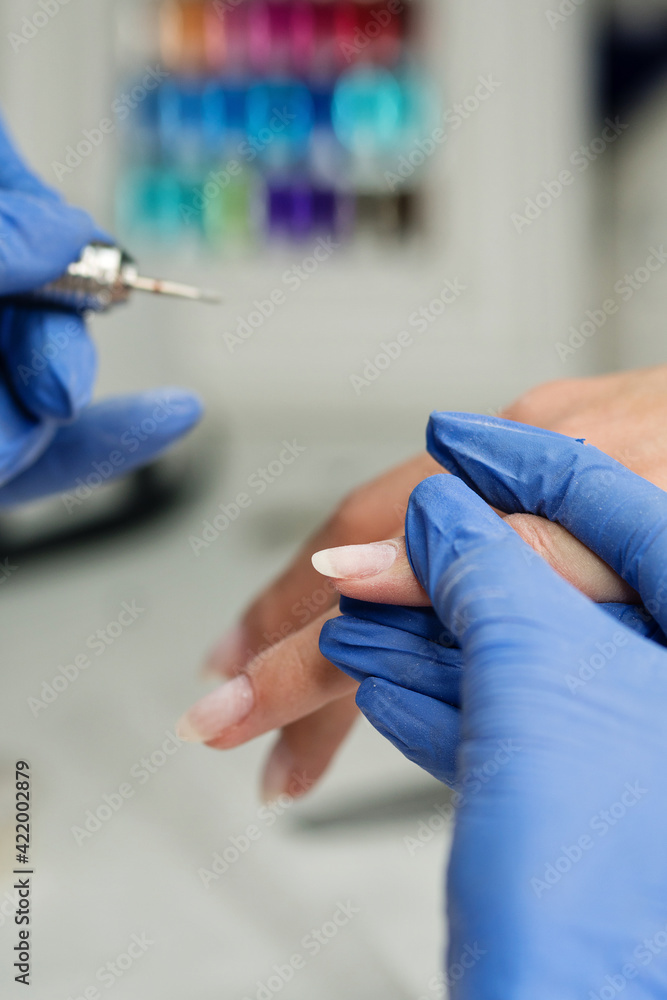 Master Hardware Manicure Shapes Nails And Cuticles Close Up. Hardware manicure. Body Care And Beauty Treatment Concept. Professional Nail Service. Soft Focus Master Hardware Manicure Shapes Nails And Cuticles Close Up. Hardware manicure. Body Care And Beauty Treatment Concept. Professional Nail Service. Soft Focus