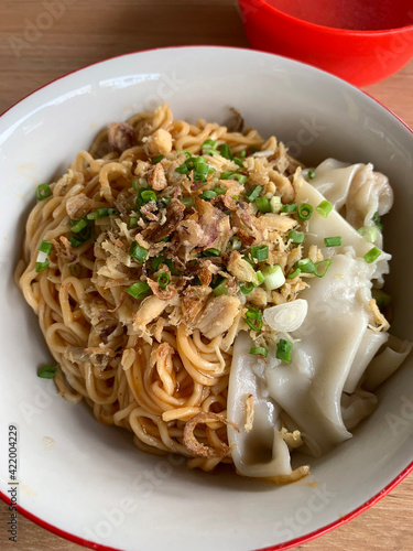 Chicken noodle or mi ayam with wonton. photo