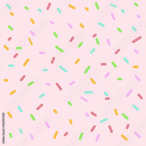 pink background with colorful confetti and sprinkles, colorful pattern