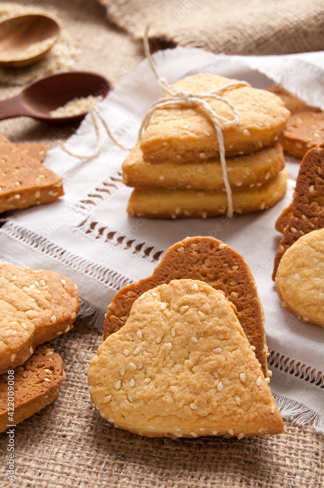 Homemade crispy cookies with sesame seeds in the shape of heart Homemade crispy cookies with sesame seeds in the shape of heart