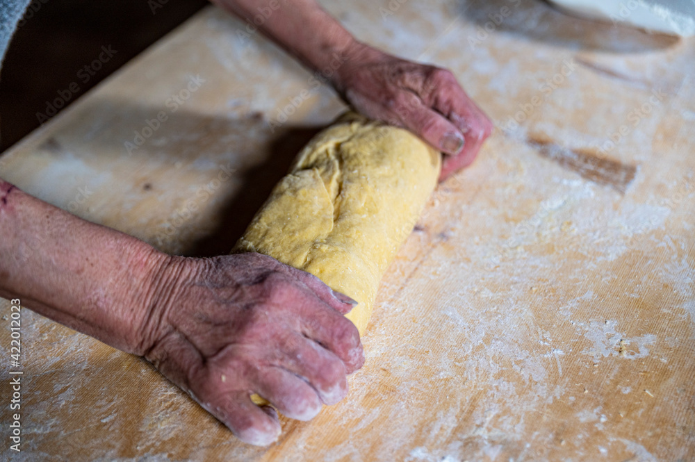grandmother preparing homemade pasta