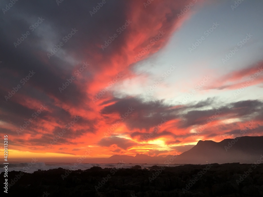 red sunset over the mountains of the coastal town Hermanus