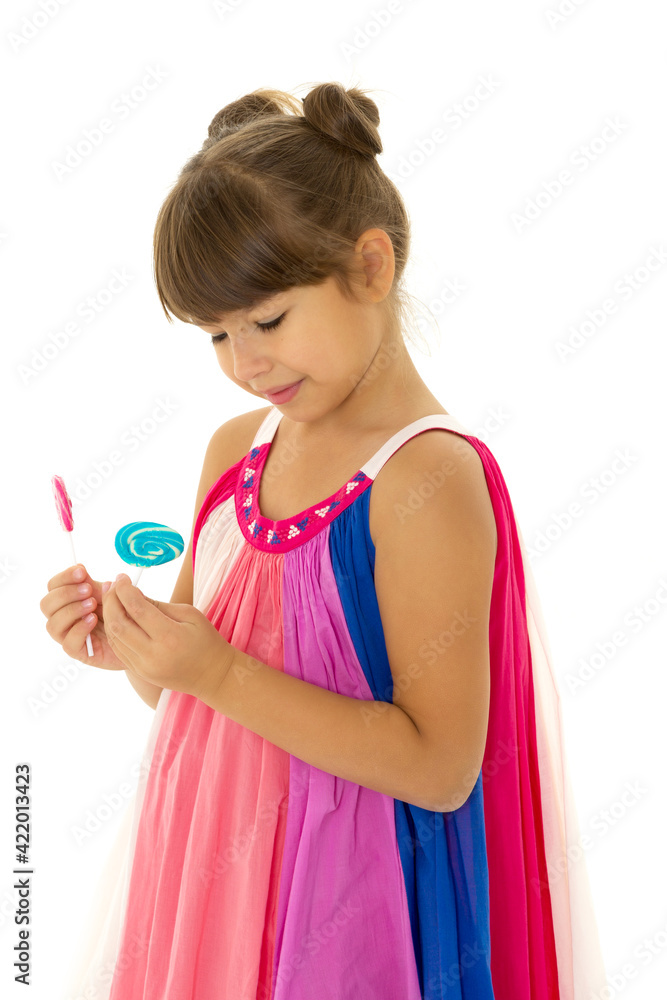 Pretty girl posing with lollipops. Photo session in the studio Pretty girl posing with lollipops. Photo session in the studio