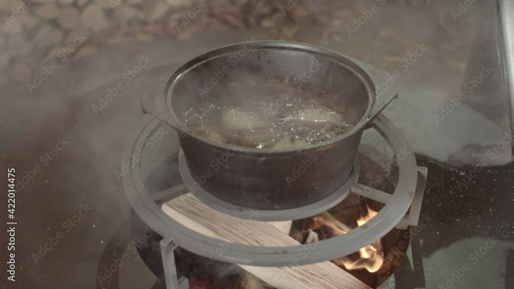 We make mulled wine over an open fire. Cooking mulled wine in a grill pot. Mulled wine and designer round metal brazier. We make mulled wine over an open fire. Cooking mulled wine in a grill pot. Mulled wine and designer round metal brazier.