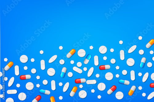 abstract background for medicine. various capsules, tablets and pills scattered on the table.Painkillers, antibiotics, vitamins, amino acids, minerals, bio active additive, sports nutrition.