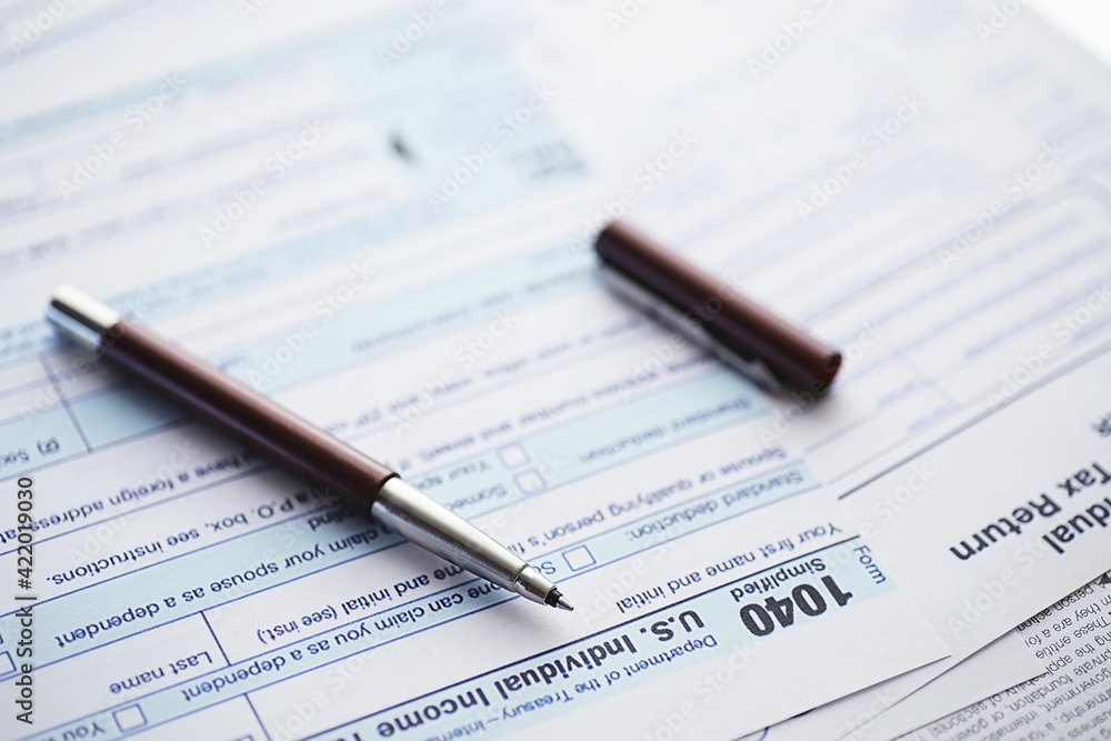 Annual tax reporting. Tax form on the table. Financial statements for signature. Annual tax reporting. Tax form on the table. Financial statements for signature.