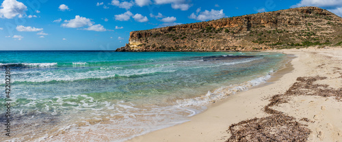 Fototapeta Naklejka Na Ścianę i Meble -  Pano of The Rabbit beach in Lampedusa, Pelagie islands. A wild beach, protected by WWF , for being home of the extinct loggerhead turtles, who lay theirs eggs in the area
