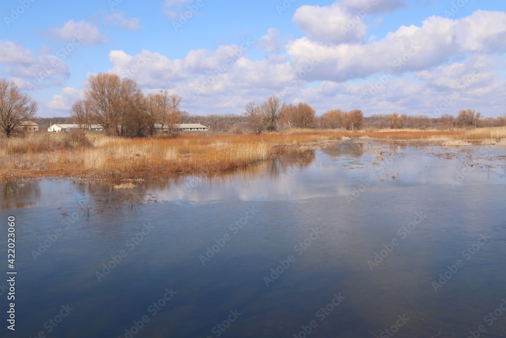 Beautiful view of the wide river and the sky with clouds. Ukraine, Cherkasy