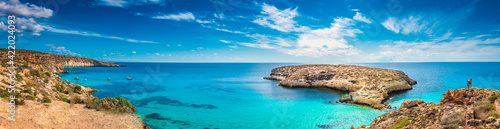 Fototapeta Naklejka Na Ścianę i Meble -  Panoramic view of The Rabbit beach in Lampedusa, Pelagie islands, a wild beach with crystal clear turquoise water