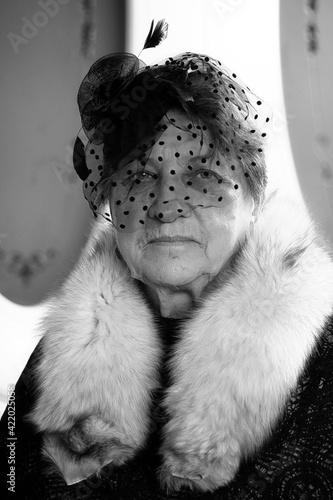 Fototapeta Naklejka Na Ścianę i Meble -  Retro grandmother smoking black and white photo