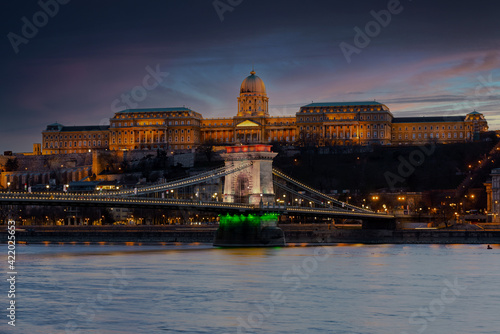 The famous Chain bridge in Budapest festive illuminated with national flag colours due national celebrate day. Zhis day is march 15. the memorial day od 1848-48 revolutional liberty war photo