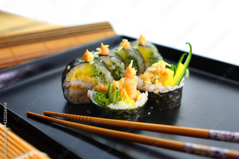 colorful and interesting sushi rolls served in an appetizing way colorful and interesting sushi rolls served in an appetizing way