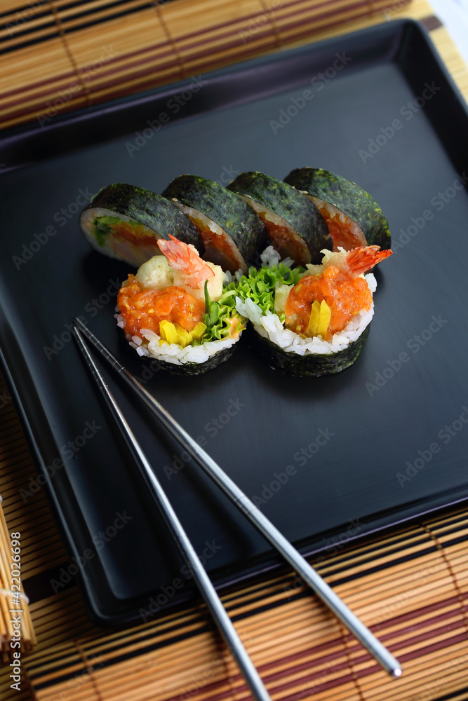 fish sushi on a ceramic plate in a traditional asian recipe fish sushi on a ceramic plate in a traditional asian recipe